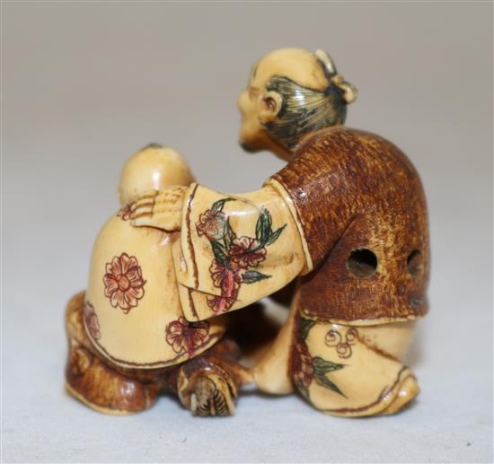 A Japanese ivory polychrome decorated netsuke, first half 20th century, height 4cm